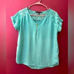 Turquoise blouse.